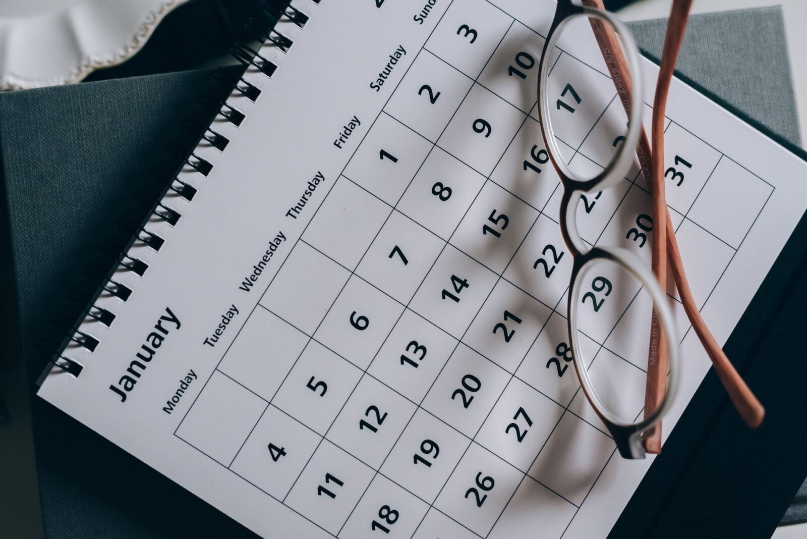 a pair of glasses on a calendar