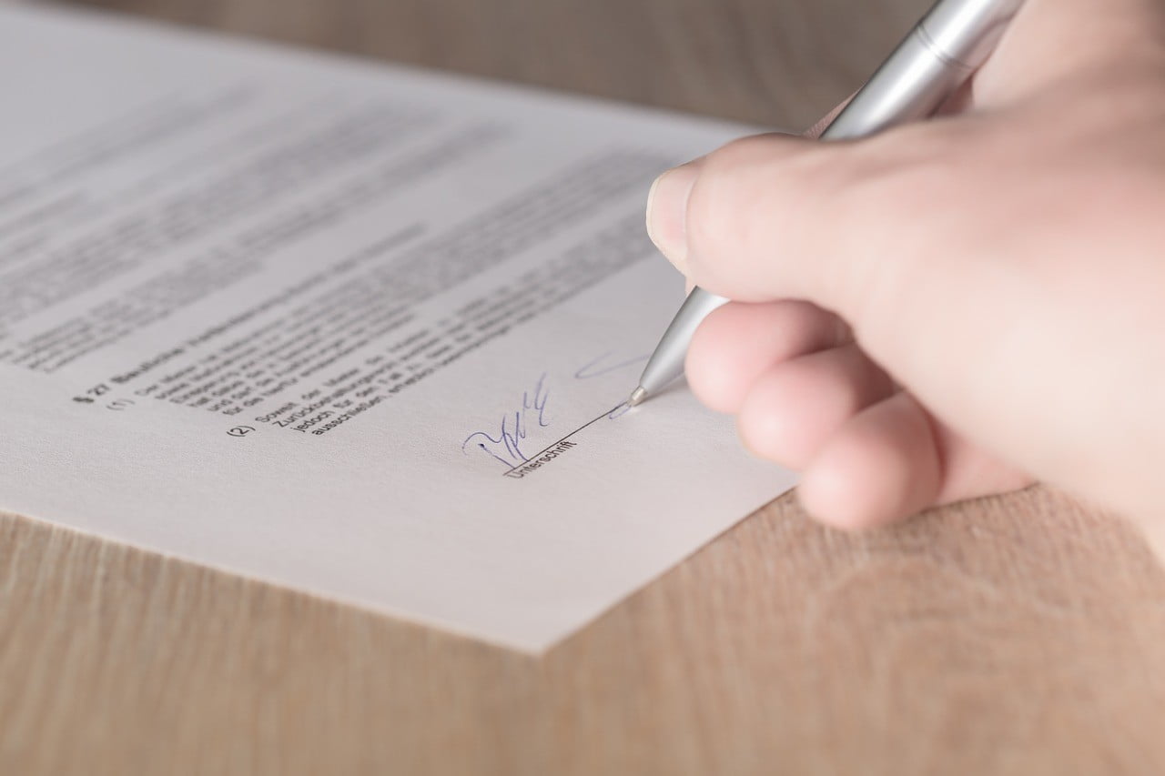 a tenant signing a leasing contract